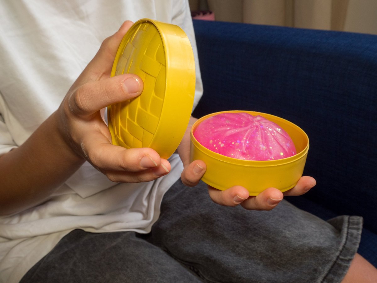 Child opening a squishy toy surprise from an advent calendar